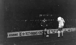 Graham French takes on the Millwall defender