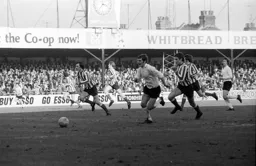 Don Shanks races on to a through ball