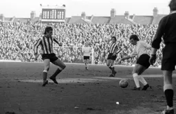 Bobby Thomson takes on the Sunderland defender with Luton Old Boy Vic Halom watching on