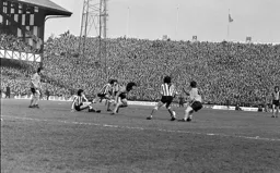 Peter Anderson tries to get through the Sunderland defence watched by packed terraces