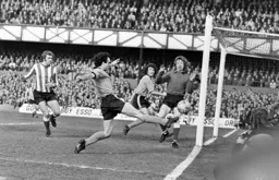 John Aston cannot reach the ball