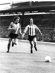 John Ryan about to win the race for the ball