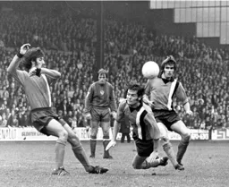 Don Shanks heads clear watched by Alan Garner and John Ryan