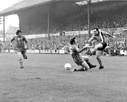 John Aston gets the ball over with his trusty left peg