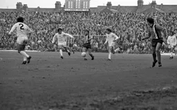 Alan West slips the ball through to John Aston