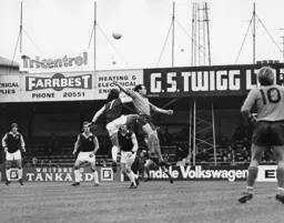 John Aston challenges the Villa defence