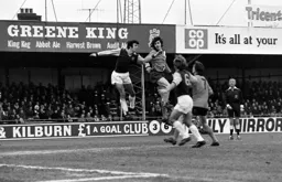 Barry Butlin clashes with Villa defender Charlie Aitken