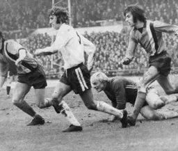 Barry Butlin leads the charge for a loose ball