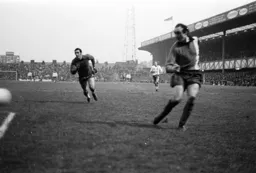 John Aston gets the ball over with the Pompey goalkeeper out of position