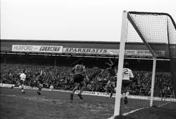 Tom Finney hopes for a loose ball