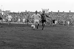 John Aston in a race for the ball with Liam O'Kane
