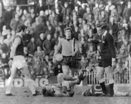 West (on ground) booked. Bobby Thomdson & ex Luton Bruce Rioch look on