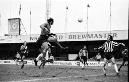 Rodney Fern gets in a flying header