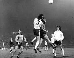 Peter Anderson challenges for the ball