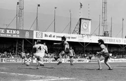 Jimmy Husband gets in his shot past Nobby Stiles