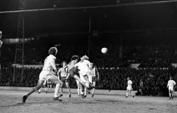 Peter Anderson gets a header in