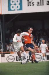 John Aston tries to get the ball off Liverpool's Peter Cormack