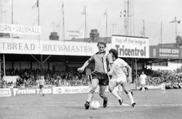Steve Litt takes the ball off Kevin Keegan