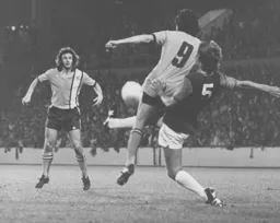 Jimmy Husband waits for Barry Butlin to lay the ball off