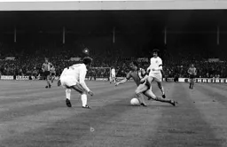 Gordon Hindson tries to get the better of Reaney and Lorimer