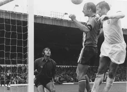 John Faulkner heads clear watched by a grateful Keith Barber