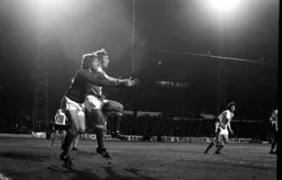 Rovers keeper fights for the ball with his own defender