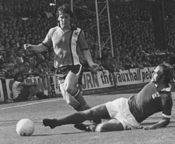 Don Shanks is tackled by Mick Mills of Ipswich