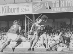 Peter Anderson vainly tries to battle through the Ipswich defence