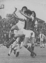 Adrian Alston tries to battle his way through the Arsenal rearguard