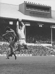 Adrian Alston is beaten to the ball by Leicester goalkeeper Peter Shilton