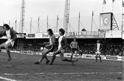 Adrian Alston waits for the ball to pass Trevor Francis