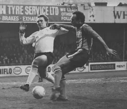 John Aston attempts to get in a cross