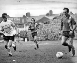 John Aston takes on Kenny Hibbitt of Wolves