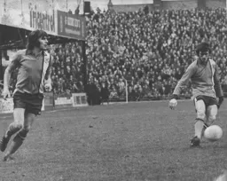 John Ryan watches Jimmy Ryan put over a free kick