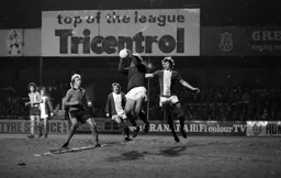 Ron Futcher watches on as the keeper gets to grip with a cross