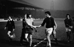 John Ryan shakes hands at the end of the game