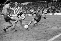 Peter Anderson rounds the keeper to score