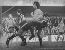 Stoke goalkeeper Peter Shilton gathers the ball from an onrushing Peter Anderson