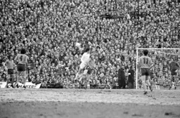 John Faulkner bravely heads the ball away