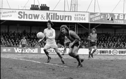 Steve Buckley defends watched on by Alan West