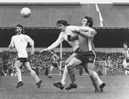 Jimmy Husband tangles with the Spurs defence