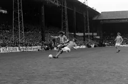 John Ryan gets the better of Dennis Tueart