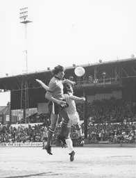Adrian Alston heads the ball across goal