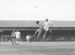 Adrian Alston in another heading duel