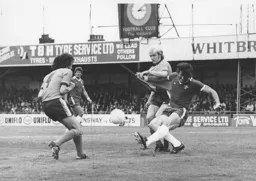 Ron Futcher is manhandled by Micky Droy