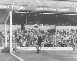 Ron Futcher is sure that the ball has gone over the line but the referee thinks differently