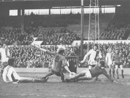 Rovers goalkeeper Roger Jones saves an effort from Ron Futcher with his feet