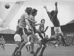 A cross flies over the heads of everyone