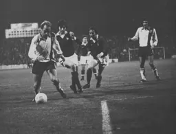 John Faulkner keeps the ball away from Barry Butlin