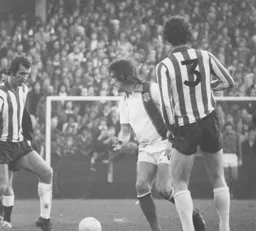 Brian Chambers looks to lay the ball off